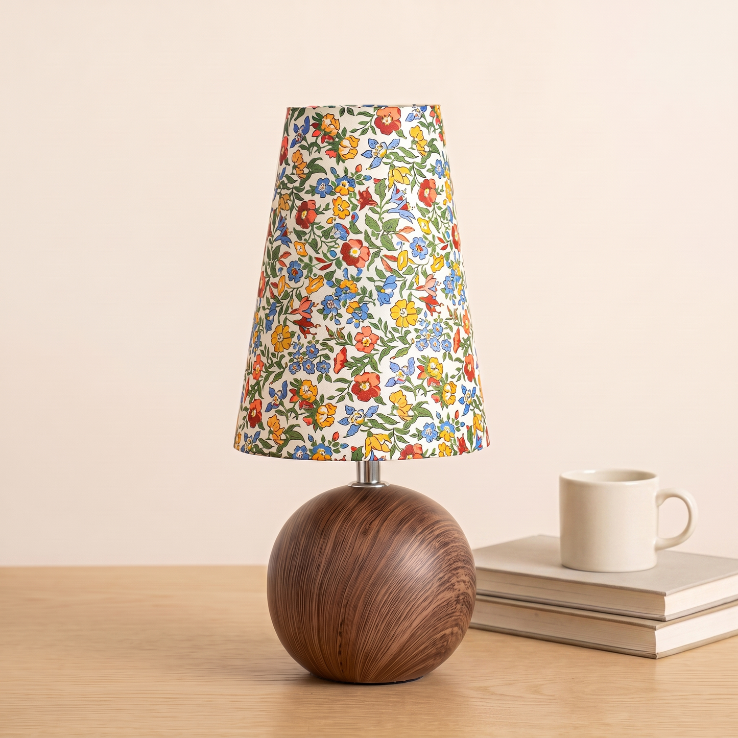 Anna Floral Table Lamp beside books and a mug to show its size