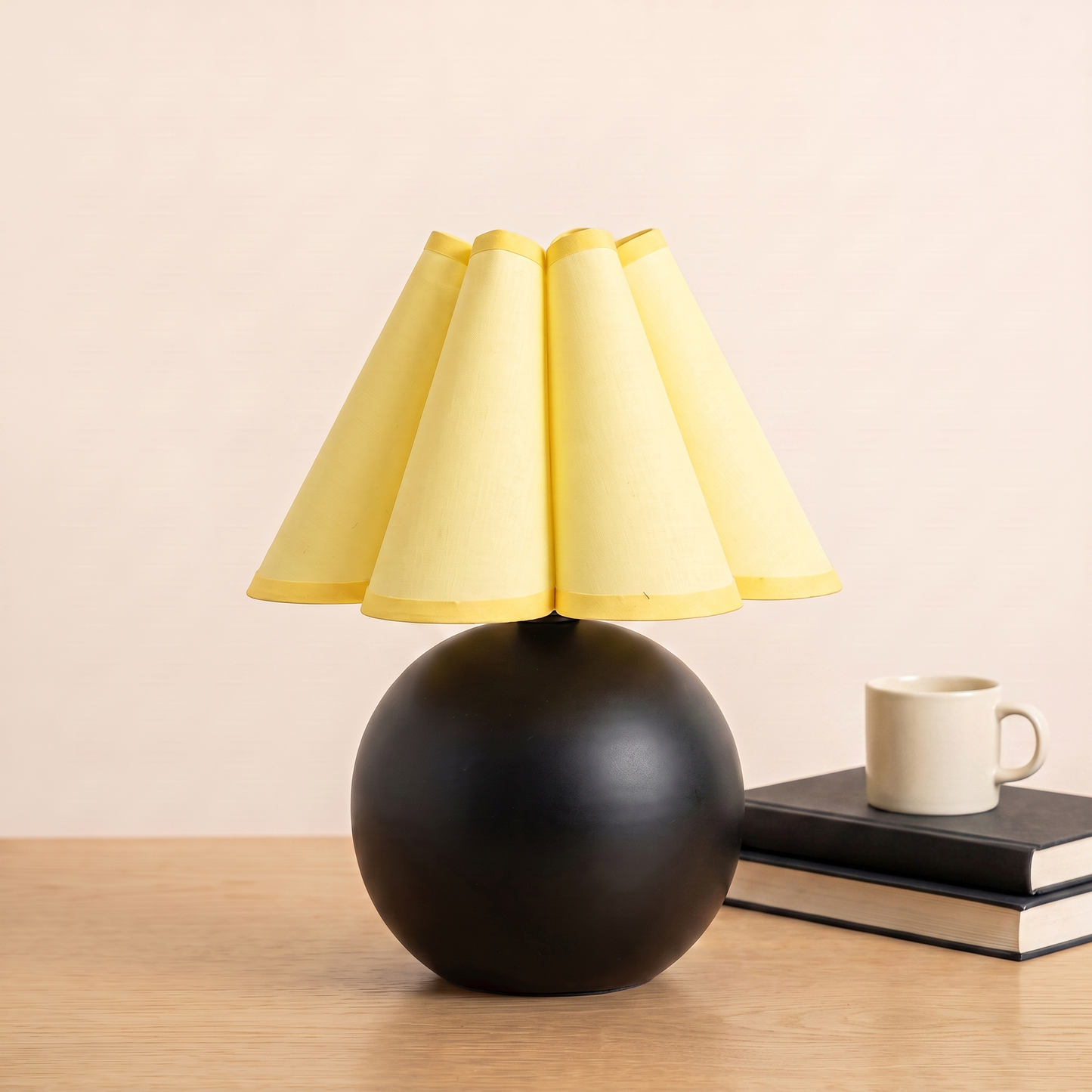 Sunburst Table Lamp beside books and a mug to show its size