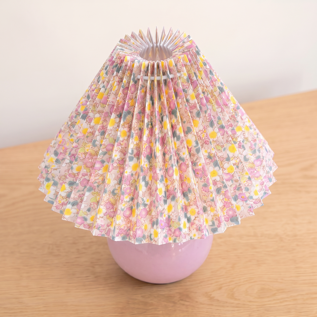 Nordic Ceramic Table Lamp, pink base, seen from a raised angle showing the pleated shade