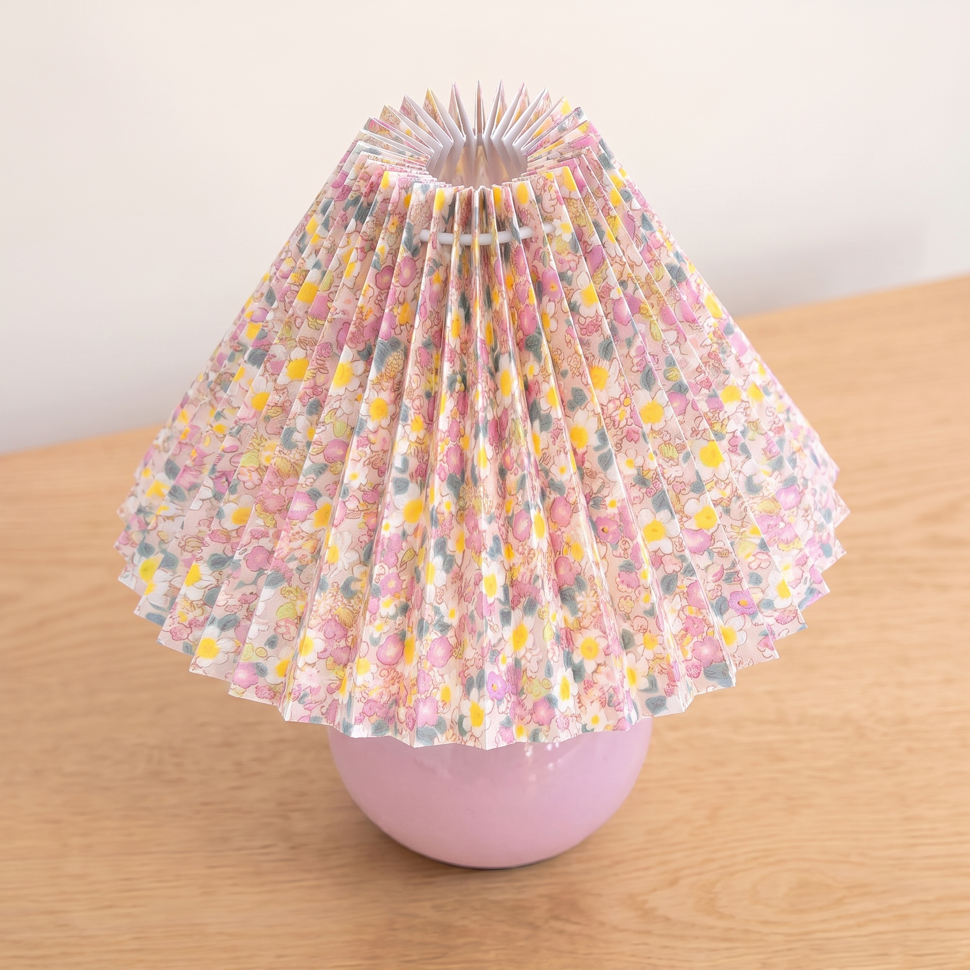 Nordic Ceramic Table Lamp, pink base, seen from a raised angle showing the pleated shade