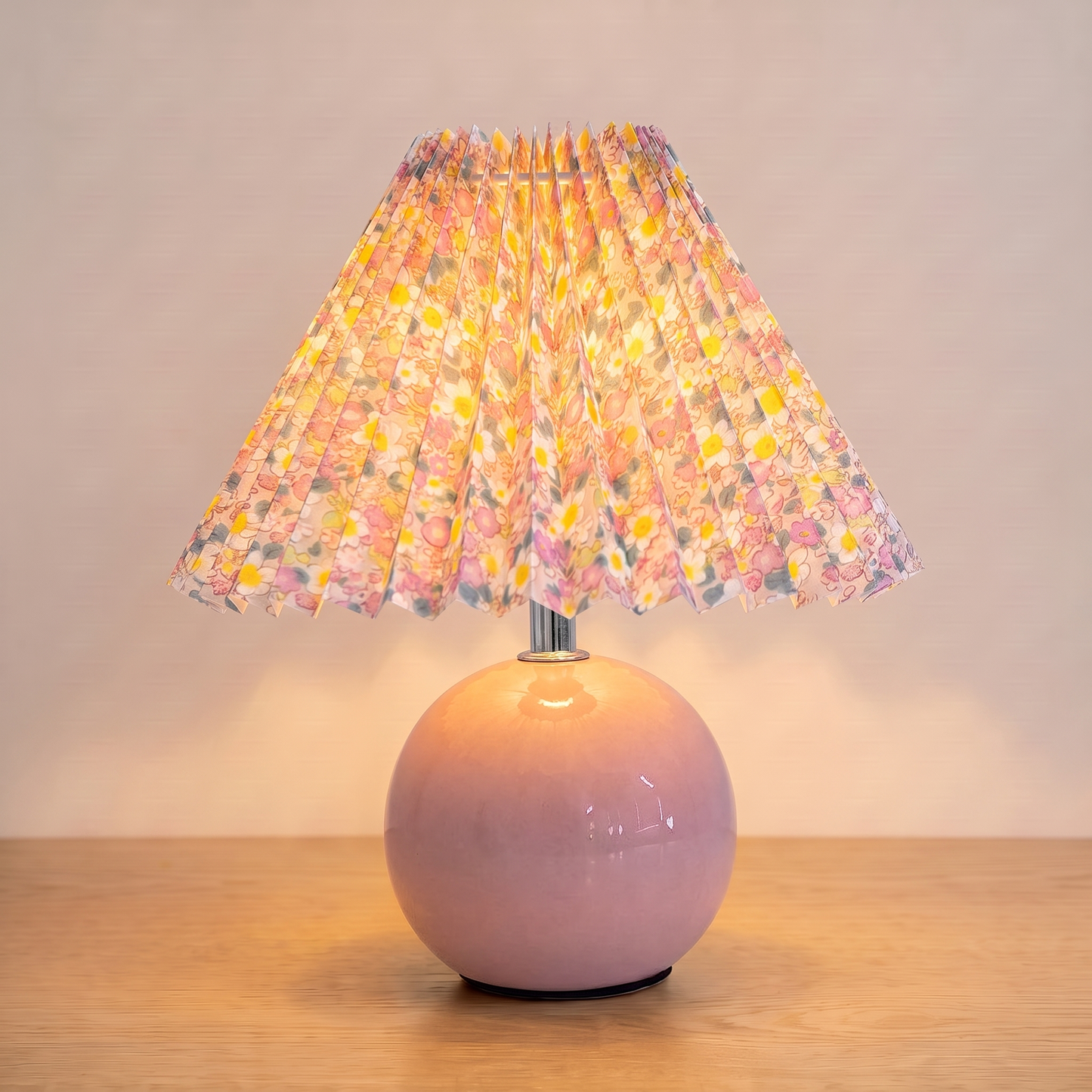 Nordic Ceramic Table Lamp, pink base, switched on with a warm glow