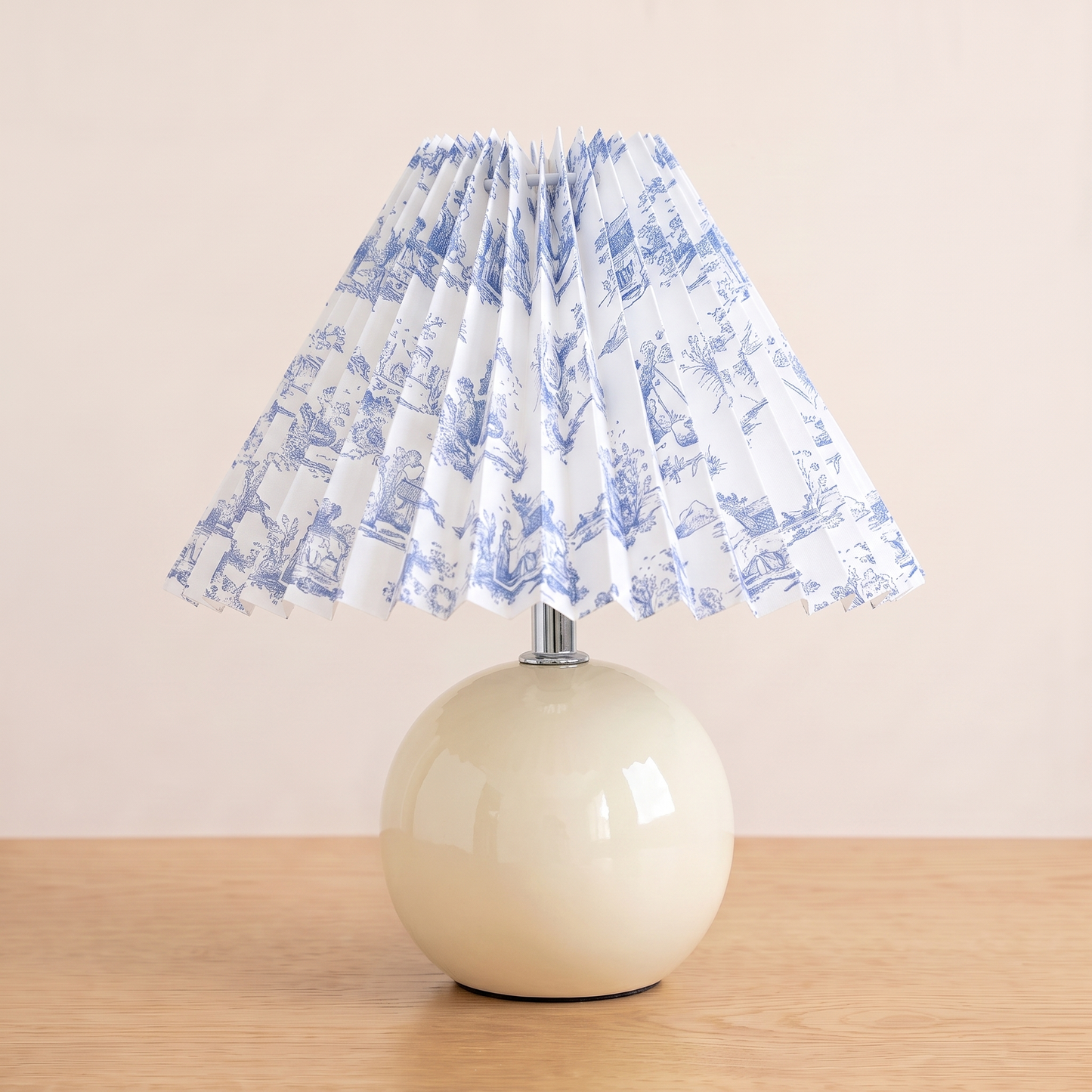 Nordic Ceramic Table Lamp with the ivory ceramic base and blue and white pleated shade
